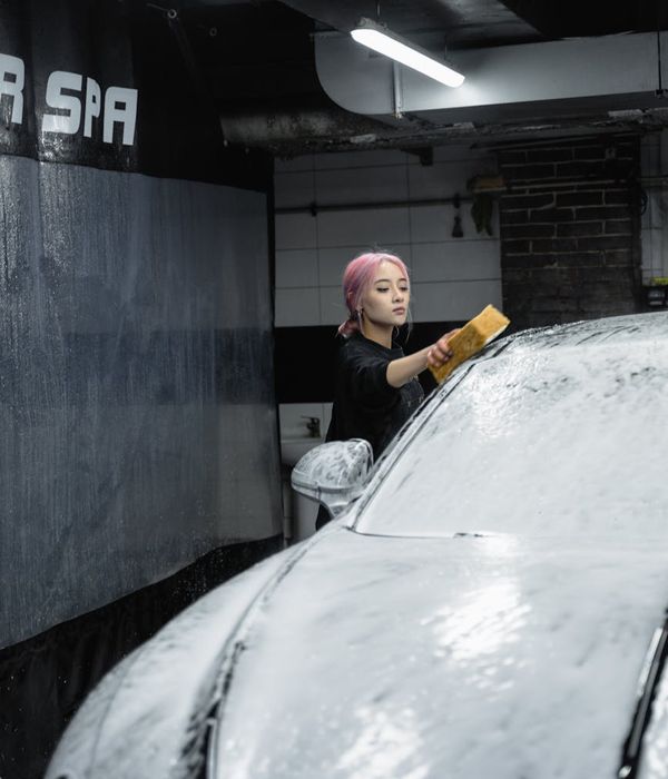 Professional automotive detailing specialist at work