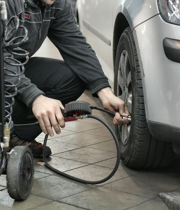 Senior automotive technician leading repair operations